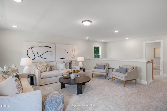 living room with recessed lighting, baseboards, and light colored carpet