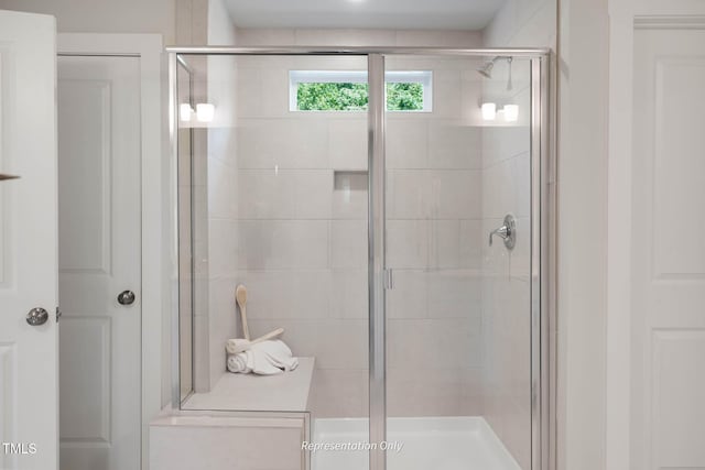 bathroom featuring a shower stall