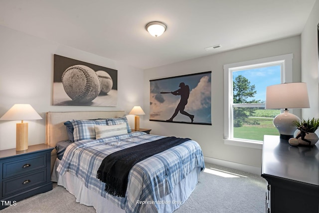 bedroom with light colored carpet and visible vents