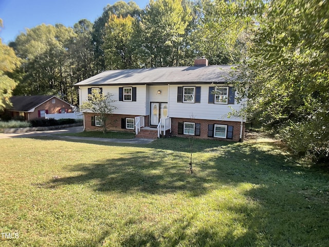 bi-level home with a front yard