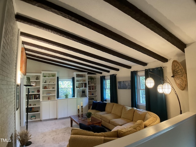 living room with vaulted ceiling with beams and light colored carpet