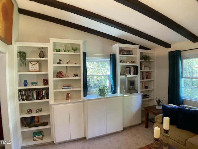 interior space featuring vaulted ceiling with beams and light colored carpet