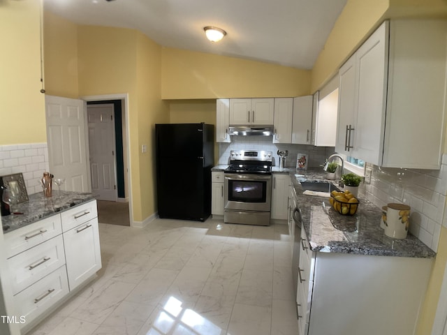 kitchen with white cabinetry, black refrigerator, electric stove, vaulted ceiling, and sink