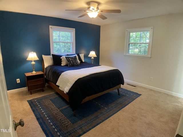 carpeted bedroom with ceiling fan