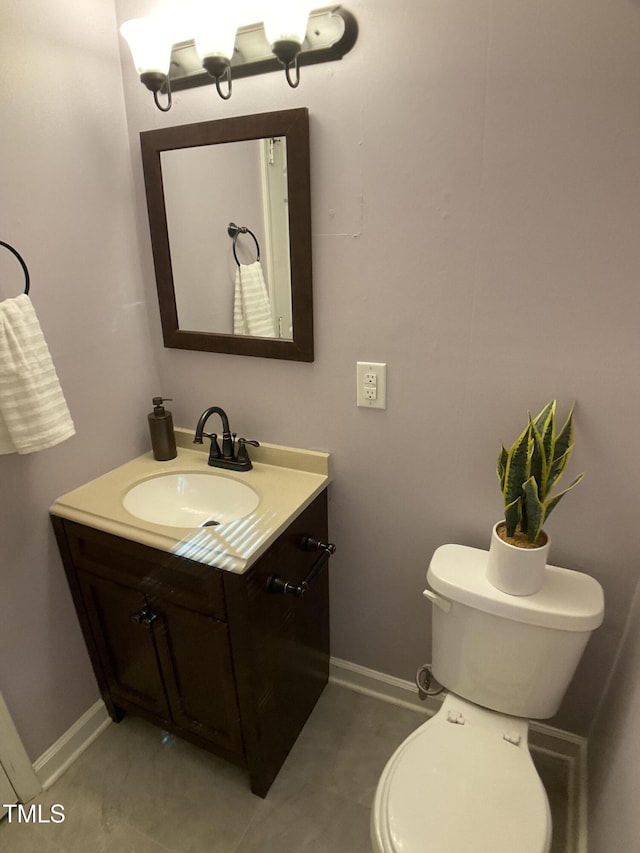 bathroom featuring toilet and vanity