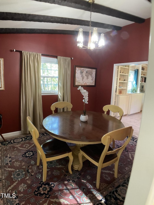 dining area featuring beam ceiling and a notable chandelier