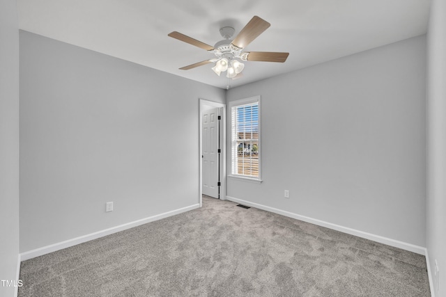 empty room featuring carpet and ceiling fan