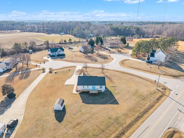 birds eye view of property with a rural view