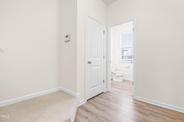 hall with light wood-type flooring