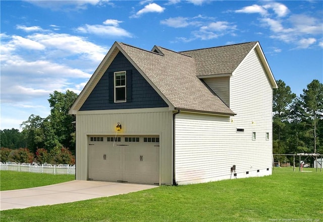 view of property exterior with a garage and a yard