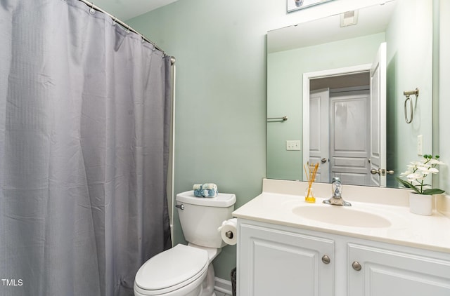 bathroom with toilet and vanity