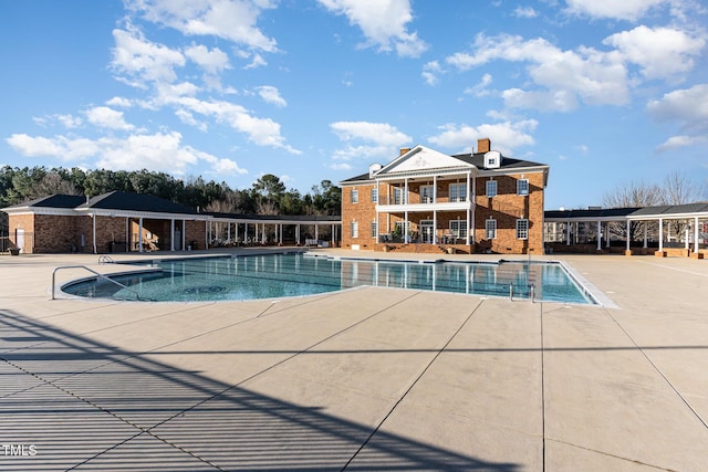 view of pool featuring a patio