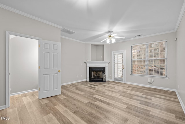 unfurnished living room with ornamental molding, ceiling fan, and light wood-type flooring