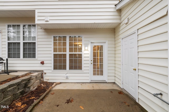 property entrance with a patio area