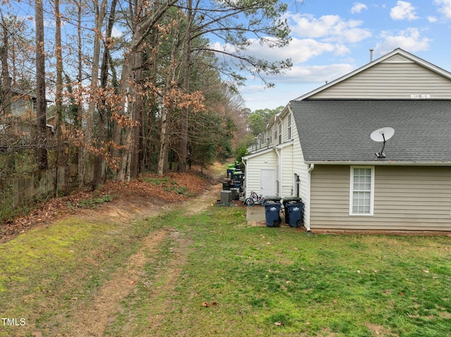 view of side of property with a lawn