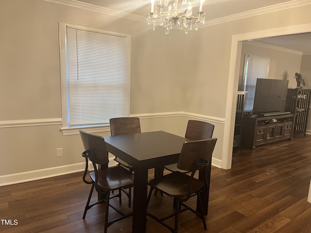 dining space with dark hardwood / wood-style flooring, crown molding, and a notable chandelier