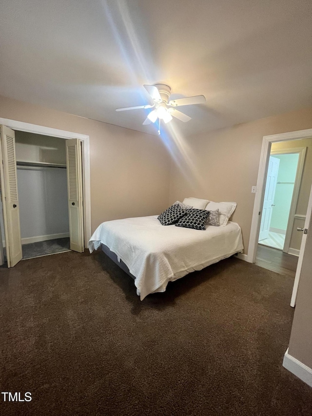 carpeted bedroom featuring ceiling fan and a closet