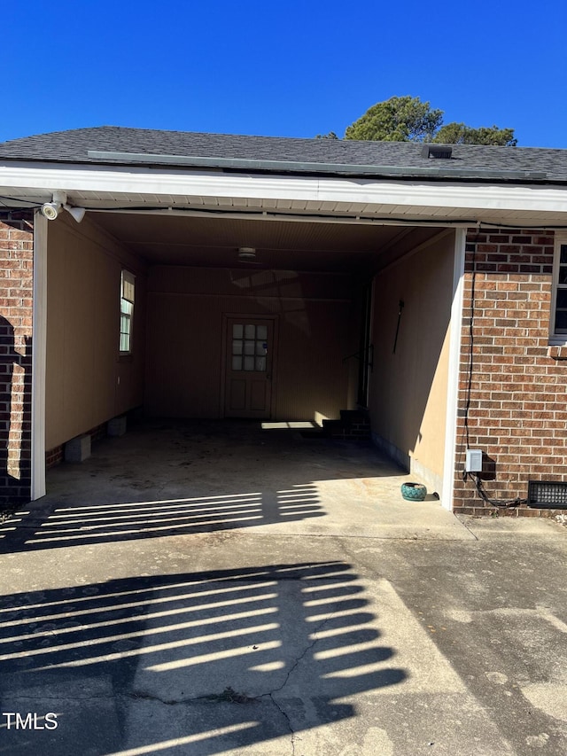 view of vehicle parking with a carport