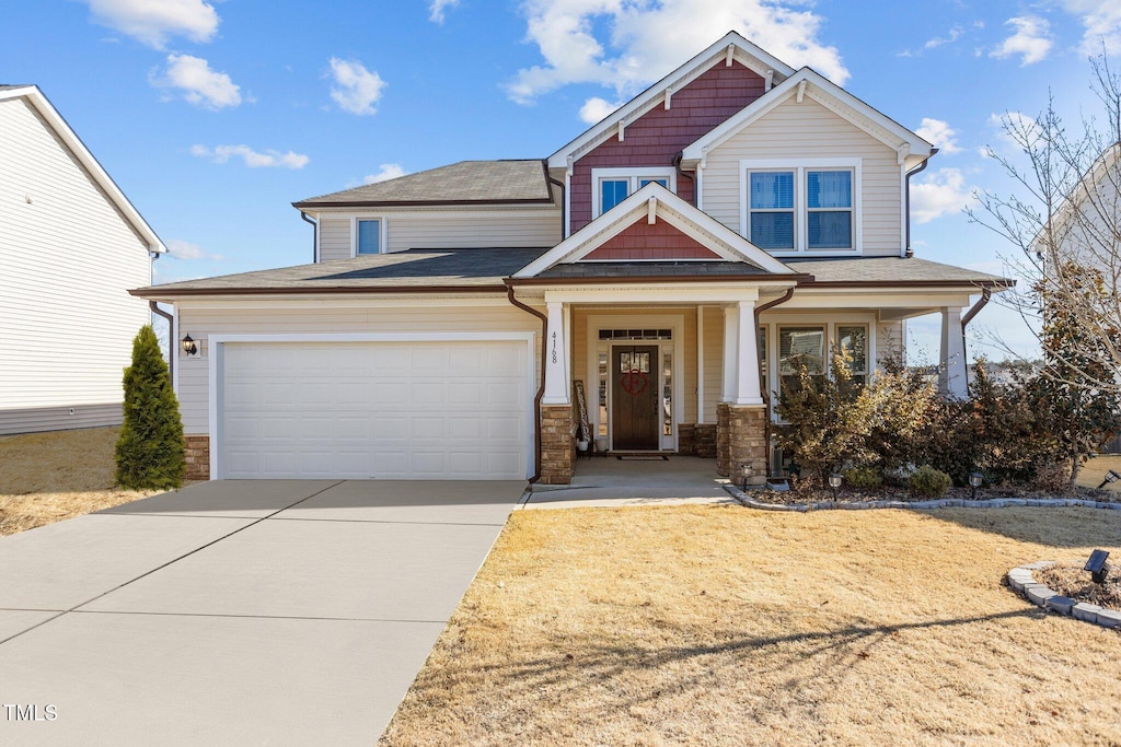 craftsman-style house with covered porch and a garage