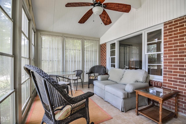 sunroom / solarium featuring ceiling fan and lofted ceiling