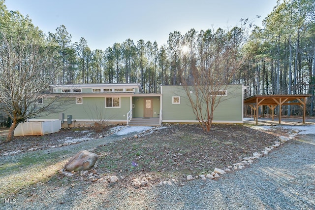 view of front of house featuring a carport