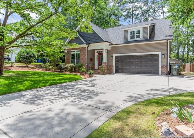 craftsman-style home with a front lawn and a garage