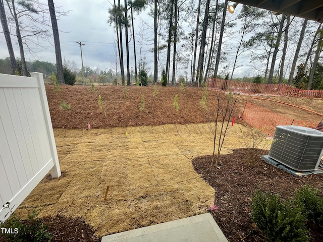 view of yard with central AC unit