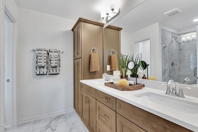 bathroom featuring a shower with shower door and vanity