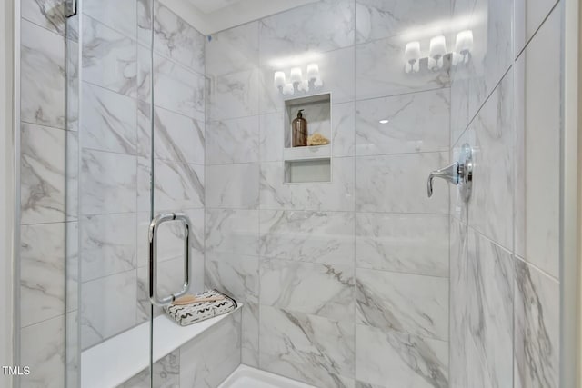 bathroom with a tile shower