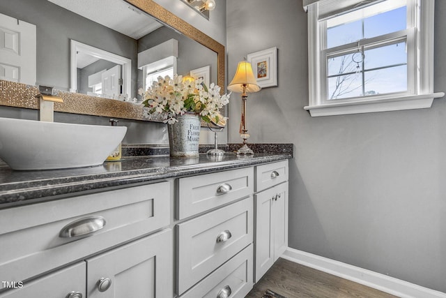 bathroom featuring vanity and hardwood / wood-style flooring