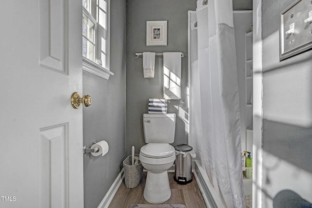 bathroom featuring hardwood / wood-style floors and toilet