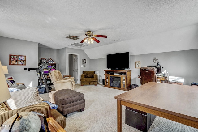 living room featuring ceiling fan, carpet flooring, a textured ceiling, and lofted ceiling