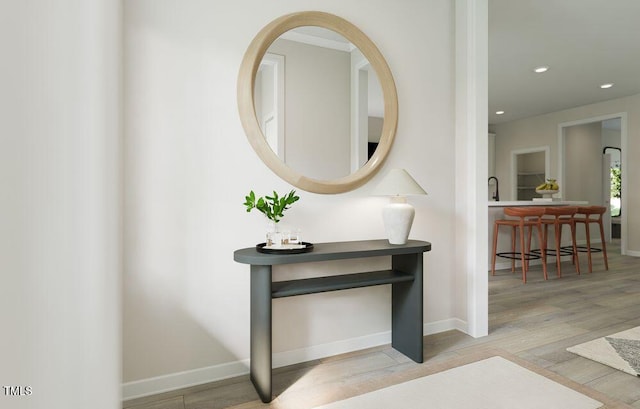 interior space with sink and light hardwood / wood-style flooring