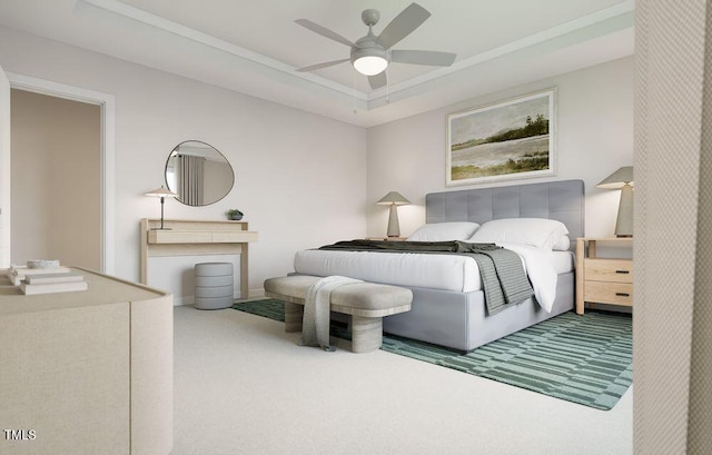 bedroom featuring ceiling fan, carpet, and a tray ceiling