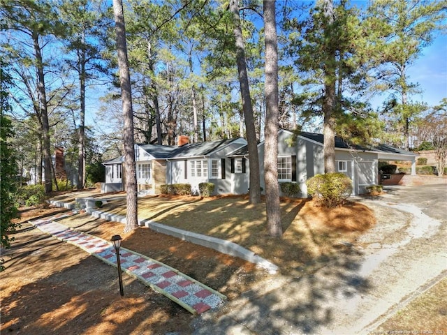 ranch-style house featuring a carport