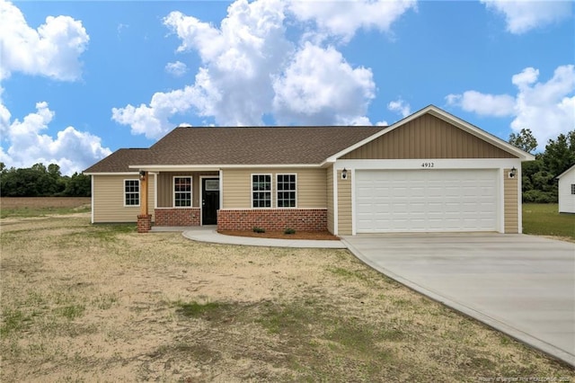 4912 NC-72 Hwy W, Lumberton, NC 28360 - ranch-style home featuring roof with shingles, an attached garage, brick siding, and concrete driveway