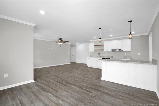 kitchen featuring white cabinetry, ceiling fan, sink, kitchen peninsula, and light stone counters