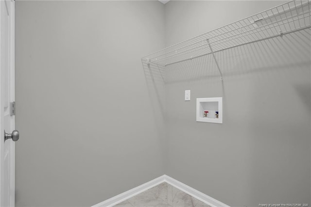 clothes washing area featuring tile patterned floors and hookup for a washing machine