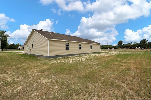 view of property exterior featuring a lawn