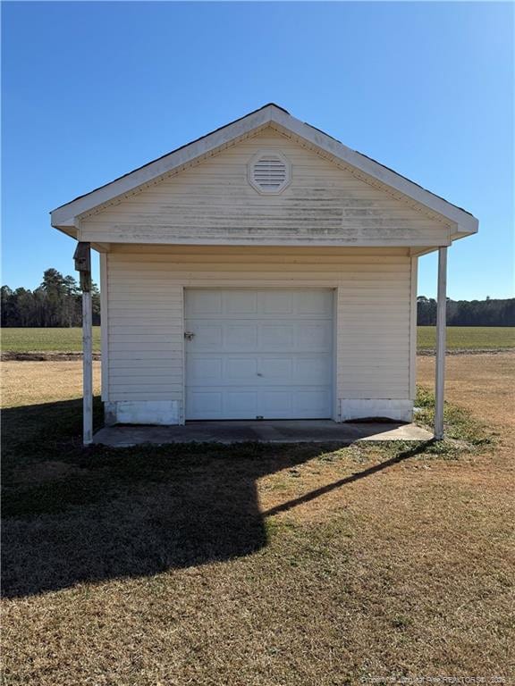 garage featuring a yard