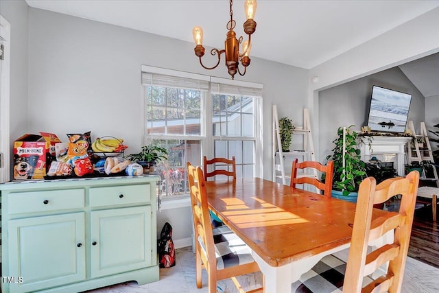 dining area featuring an inviting chandelier