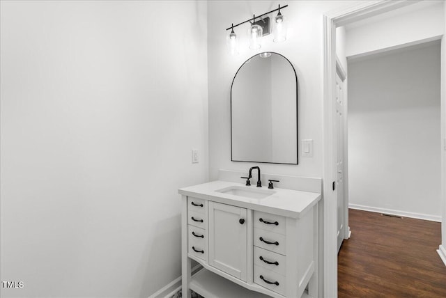 bathroom featuring hardwood / wood-style flooring and vanity