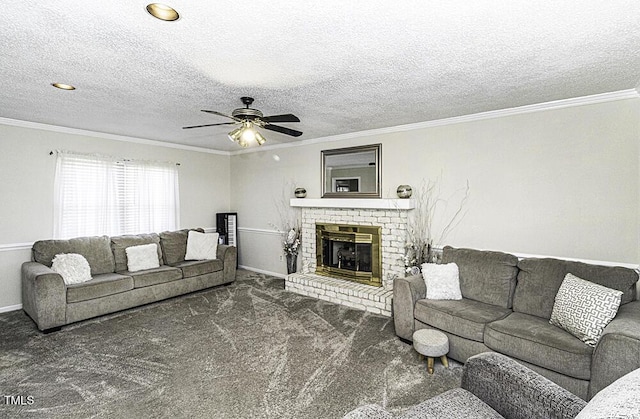 living room with ornamental molding, a brick fireplace, a textured ceiling, and dark colored carpet