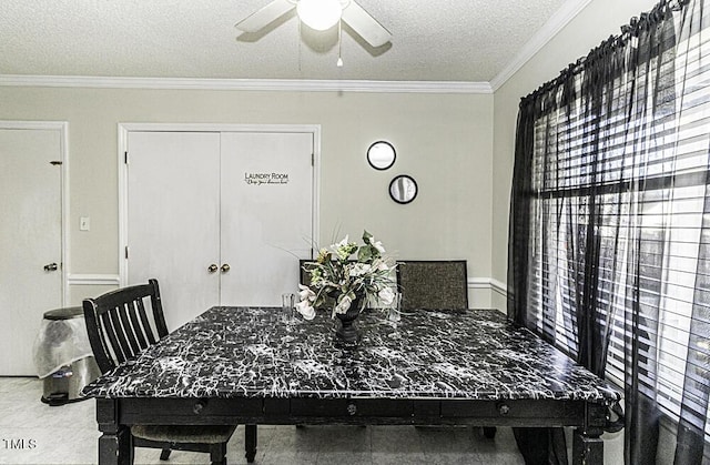 dining room with ceiling fan, ornamental molding, and a textured ceiling