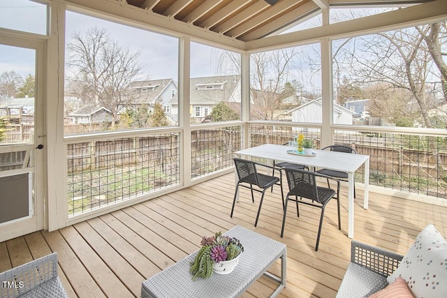 sunroom with a residential view