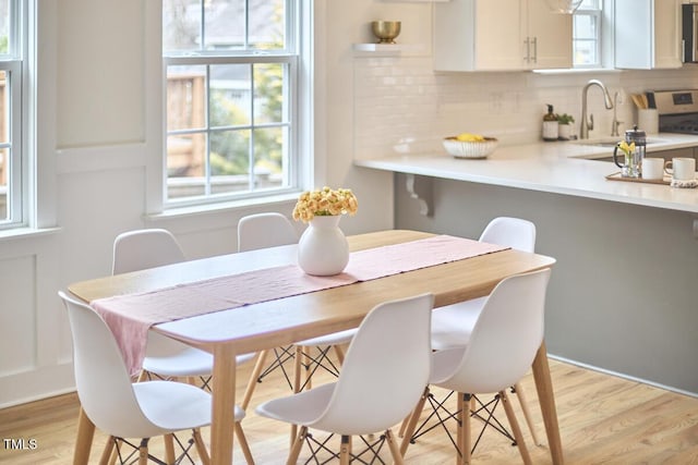 dining area with light wood-style floors