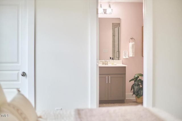 full bath featuring a stall shower and vanity