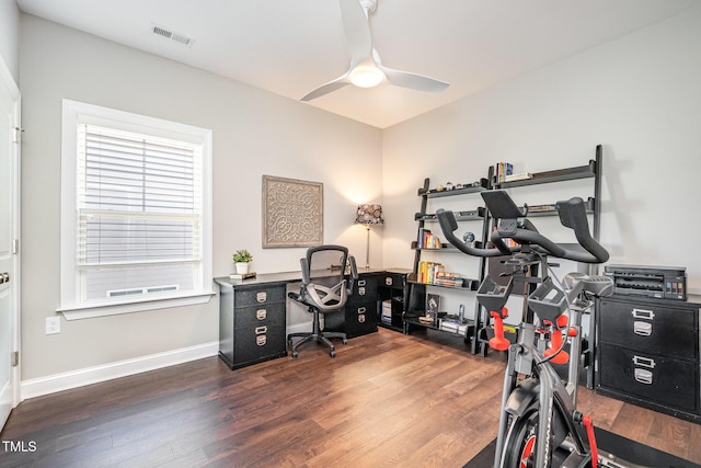 exercise area featuring dark hardwood / wood-style flooring and ceiling fan