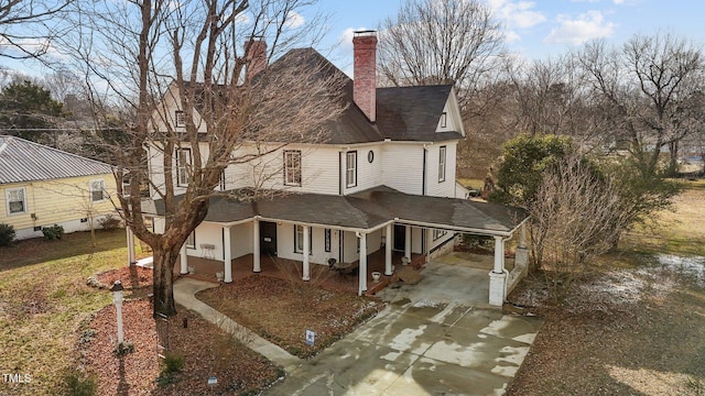 exterior space with a carport and covered porch