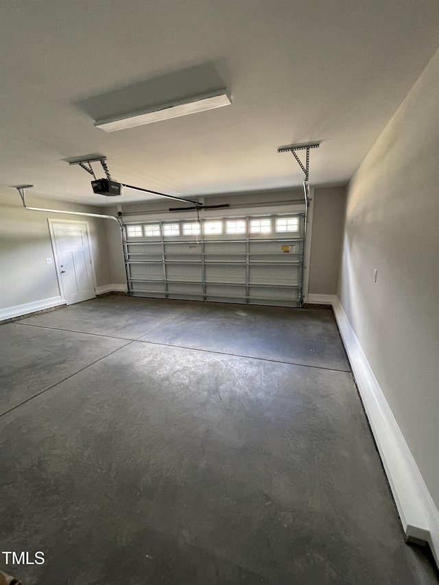 garage featuring a garage door opener